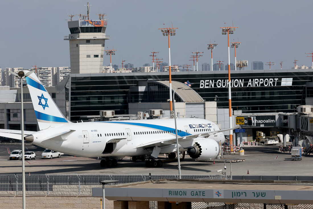 An Israeli airline El Al aircraft is parked on the tarmac.