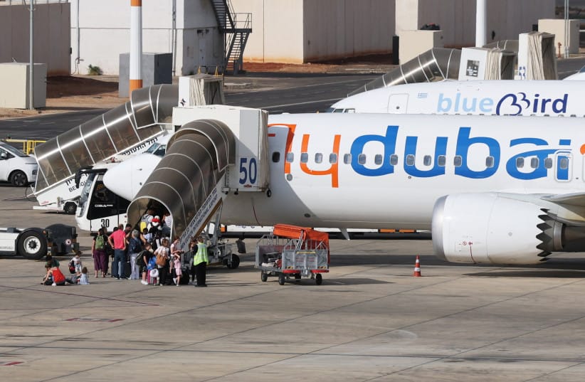 Travelers board a FlyDubai aircraft at Ben Gurion International Airport after a separate FlyDubai flight from the United Arab Emirates to Israel was diverted to Saudi Arabia following an emergency signal, in Lod, near Tel Aviv, Israel, September 30, 2026.