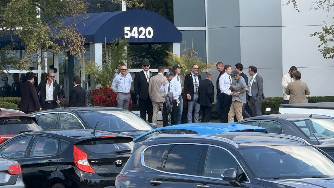 The parking lot at The Atrium in Burlington was full on Saturday. People with Dominion Society lanyards were seen in the parking lot.