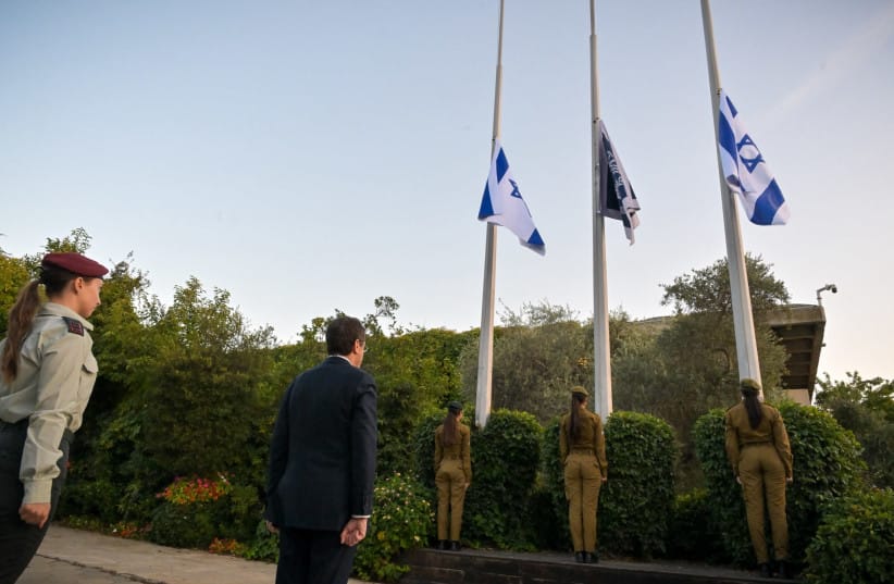 IDF soldiers lower Israeli flags to half-mast at the President's Residence in Jerusalem to commemorate the October 7 massacre, October 5, 2026.
