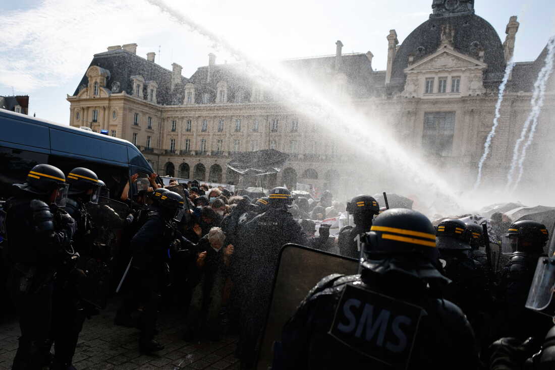Riot police use a water cannon as they face students during a protest against under-resourced schools, in Rennes, western France, Tuesday.