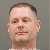 Authorities allege that David J. Rush took home tens of millions of dollars worth of gold bars from his job at the CIA, and fabricated key parts of his education and military history. He's seen here in a photo supplied by the Alexandria Sheriff's Office.