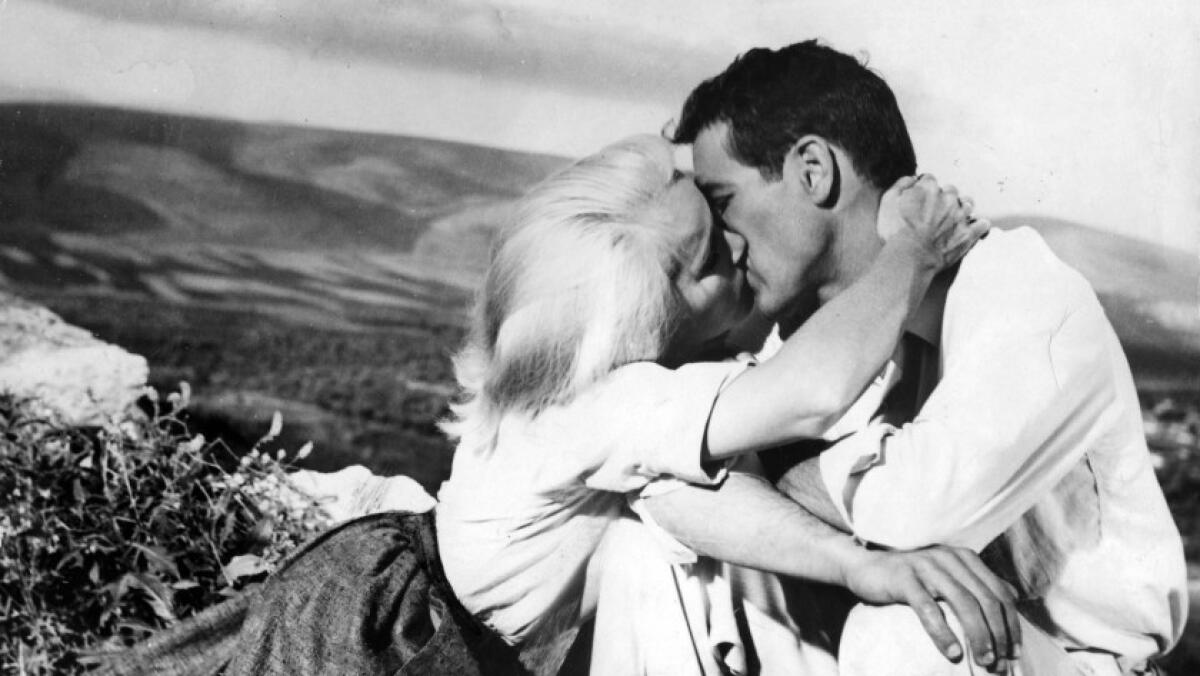 Eva Marie Saint and Paul Newman embrace in a scene in "Exodus."