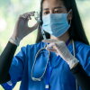 Doctor use a needle syringe to take a shot from vaccine vial,Successful,Safe and effective vaccines,The power of science against COVID-19 Virus.