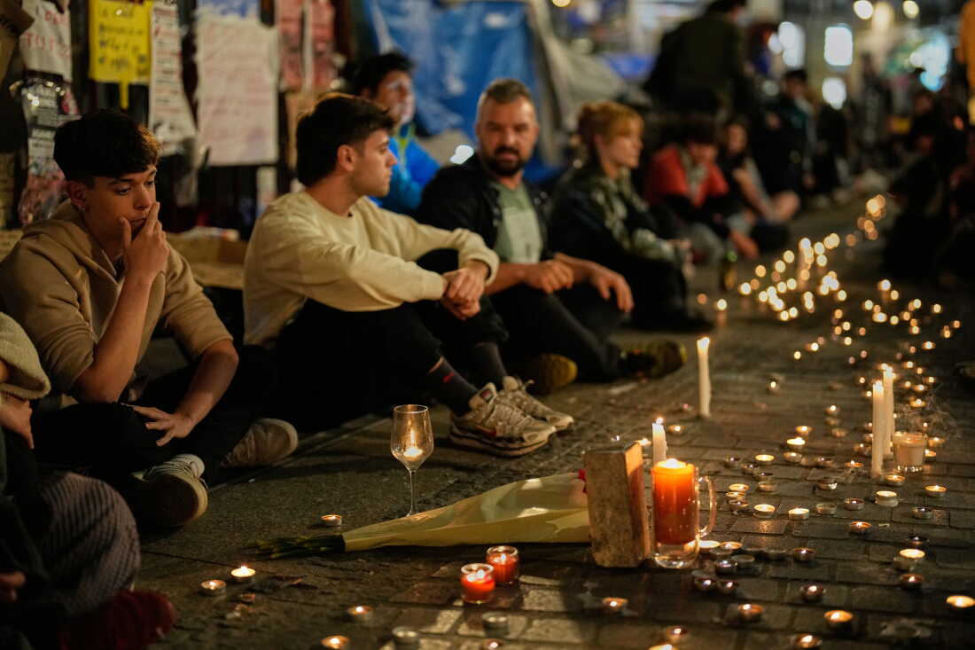 Protesters gather after the reported death of María del Carmen Abascal, the 87-year-old woman whose eviction sparked nationwide protests, in Puerta del Sol square in Madrid, Wednesday, Oct. 7, 2026.