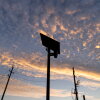 A Flock Safety license plate reader is seen last year along a public road in Houston.