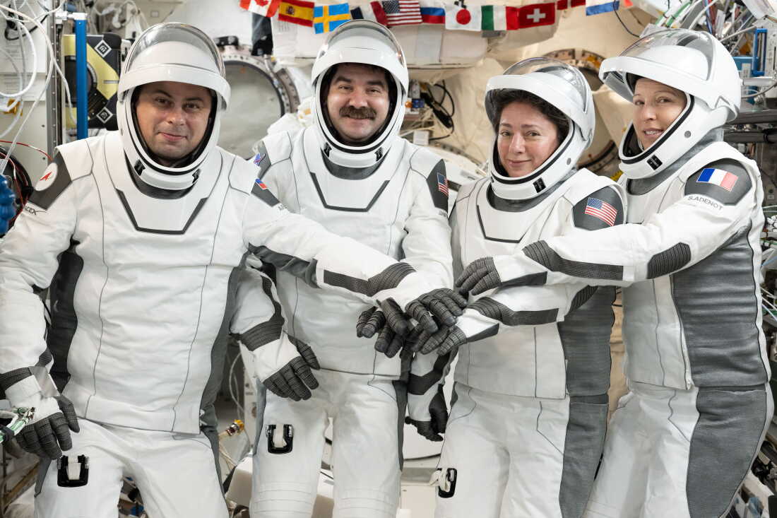 NASA's Crew-12 members gather for a portrait in the pressure suits they wore while departing the International Space Station inside the SpaceX Dragon spacecraft. From left, Roscosmos cosmonaut Andrey Fedyaev, NASA astronauts Jack Hathaway and Jessica Meir, and European Space Agency astronaut Sophie Adenot.
