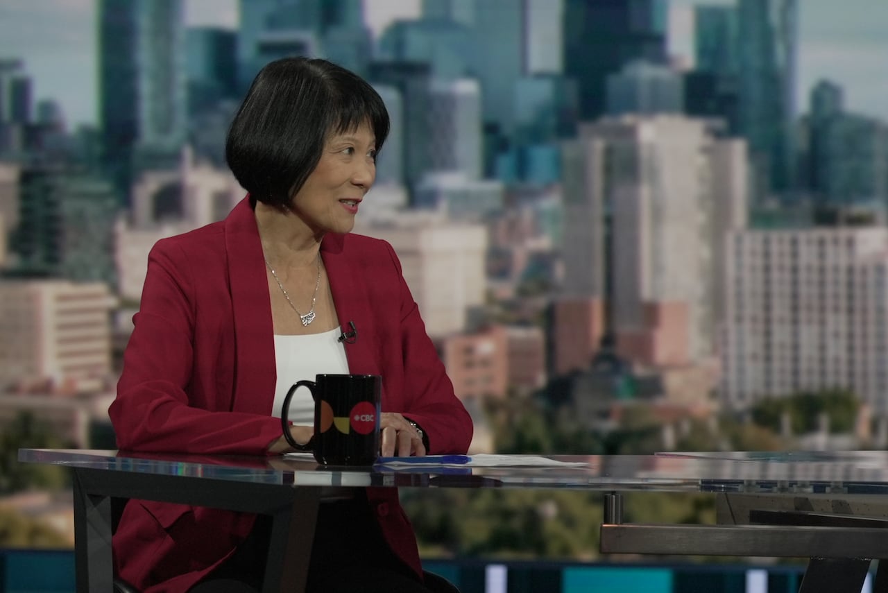 Olivia Chow sits at a table at a studio in the CBC Broadcasting Centre.