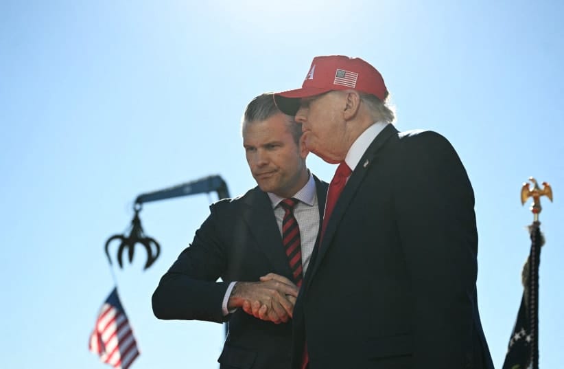US President Donald Trump (R) shakes hands with Secretary of Defense Pete Hegseth as he arrives to speak at Anduril Industries in Sparrows Point, Maryland, on October 6, 2026; illustrative
