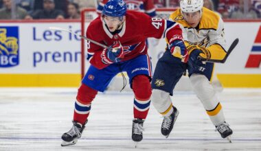 Canadiens defenceman Lane Hutson advances the puck while being pursued by Nashville Predators' Matthew Wood during first period in Montreal on Oct. 8.