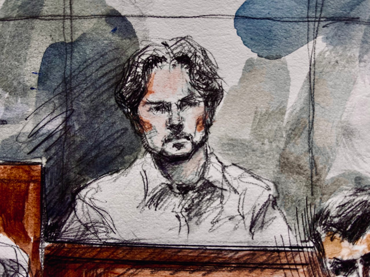 Court sketch of man with curly hair sitting down.