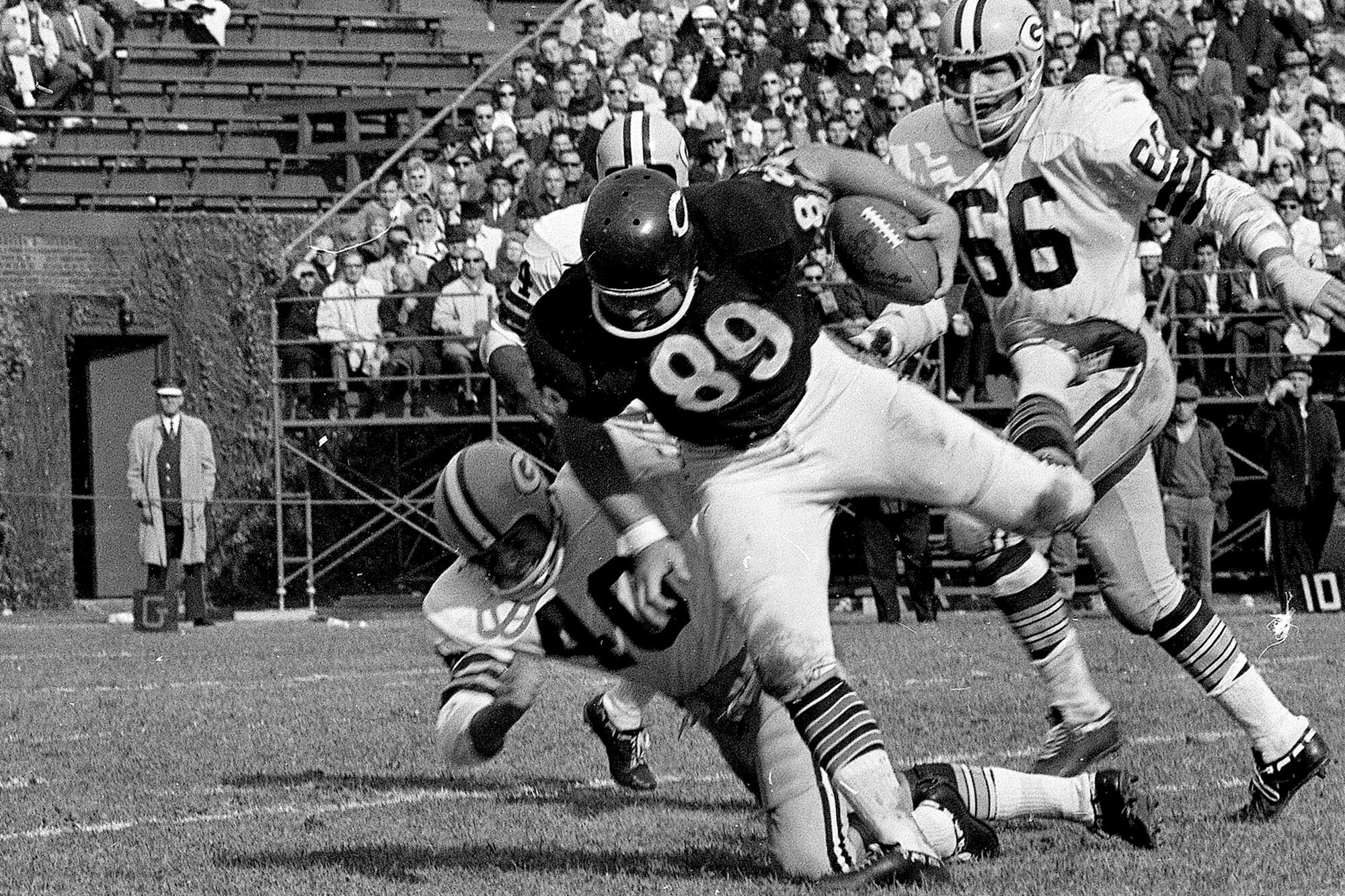 Chicago Bears tight end Mike Ditka is tackled after a pass reception against the Green Bay Packers on Oct. 16, 1966.