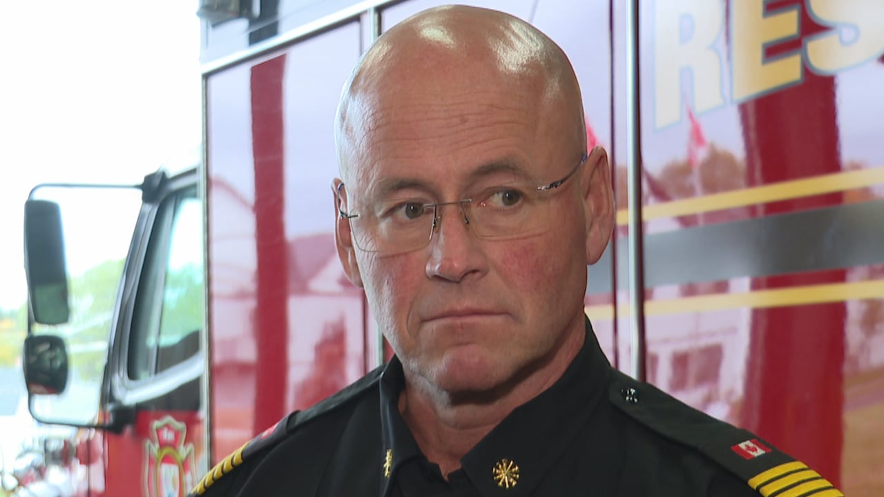 A man with glasses and a bald head