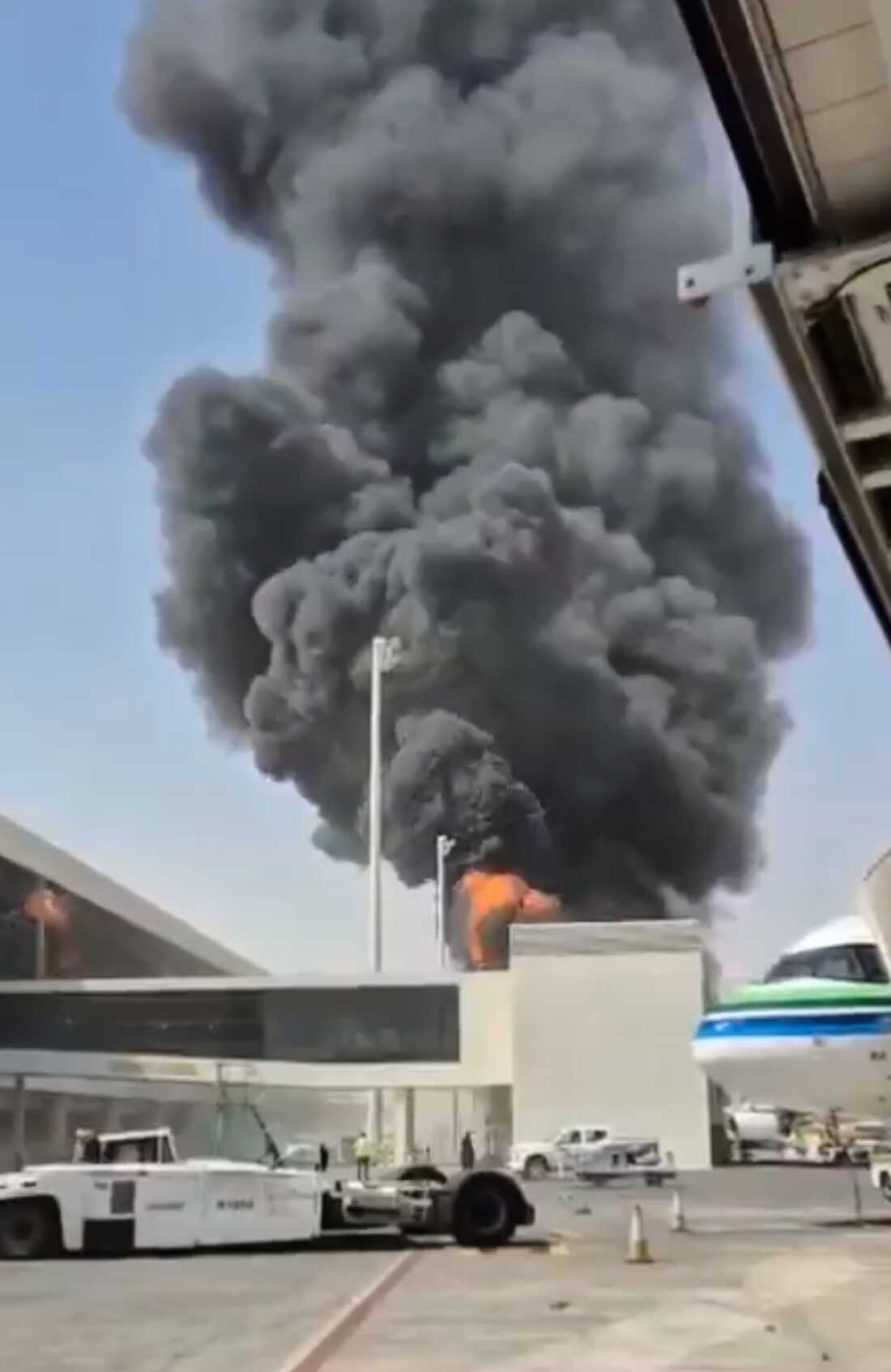 This image from video obtained and verified by AP shows thick black smoke and flames rising from a fire at King Khalid International Airport in Riyadh, Saudi Arabia, Friday, Oct. 9, 2026. (UGC via AP)