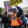 An abortion-rights protester, left, faces off against an anti-abortion protester in front of the U.S. Supreme Court in 2022.