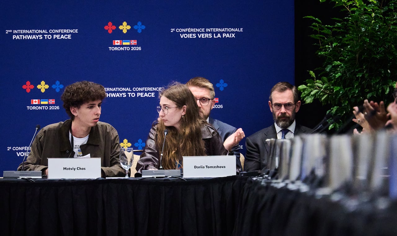 Two Ukrainian young adults speak at an international conference in Toronto.