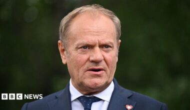 Donald Tusk, who wears a suit and has thinning blonde hair, talks to the press in Tirana, Albania, last year.