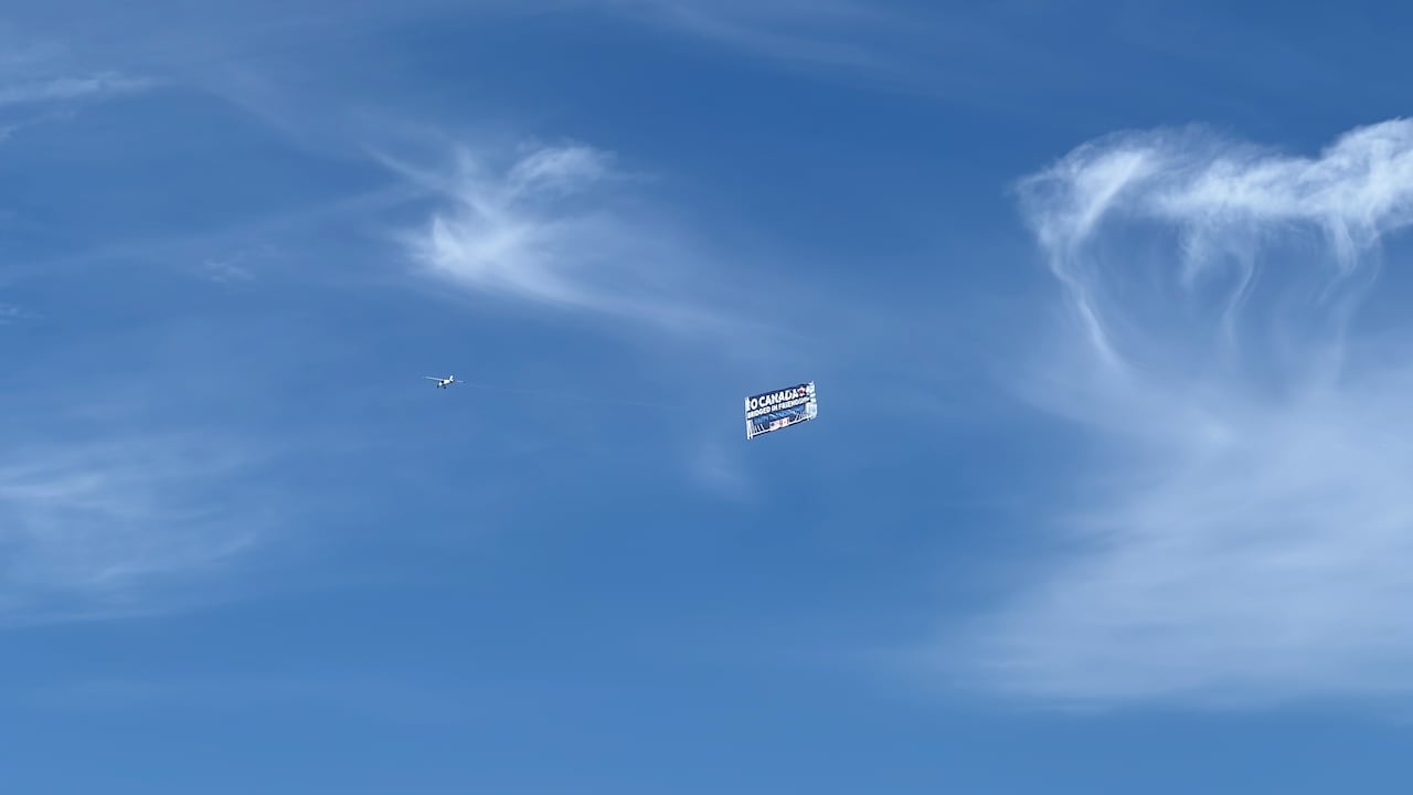 A plane drags a banner.