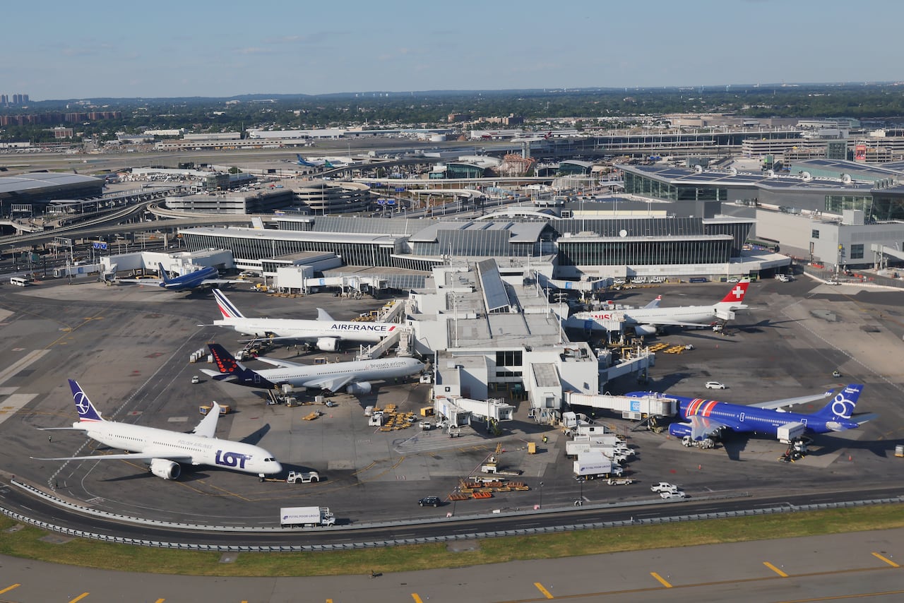 An aerial view shows planes parked at an airport.