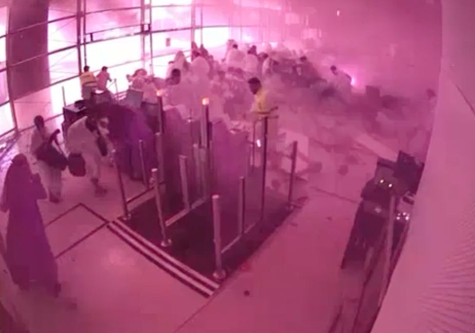 This image from CCTV shows passengers taking cover as flames and smoke fill part of King Khalid airport in Riyadh, Saudi Arabia, during an attack on Saturday 10 October 2026