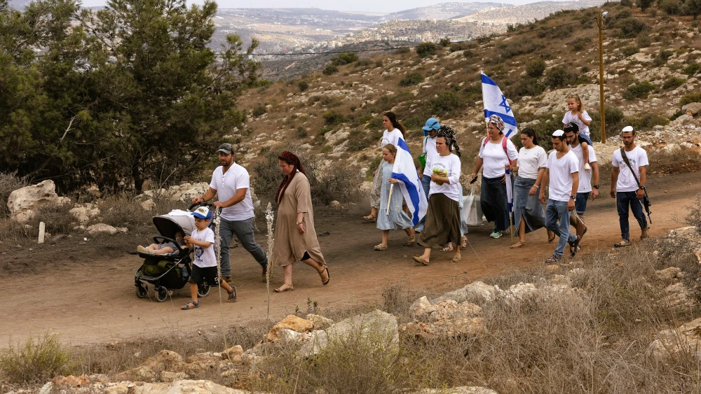 Jewish families take part in a march between the former settlements of Ganim and Kadim in the West Bank, which were evacuated as part of Israel’s 2005 disengagement plan, during the Jewish holiday of Sukkot, Sept. 30, 2026. Photo by Hilel Ben Or/Flash90