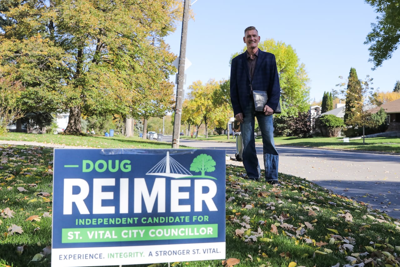 A man with a lawn sign.