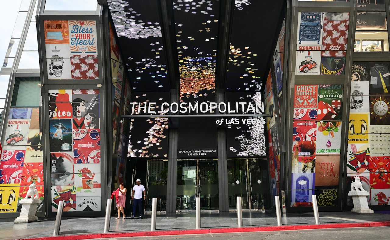 Patrons exit the Cosmopolitan hotel along Las Vegas Boulevard, in Las Vegas, Nevada, on August 19, 2026. Las Vegas, a byword for gambling and excess, has seen a 7.5 percent fall in the number of visitors — the largest ever drop outside of the pandemi