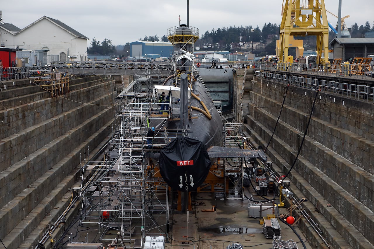 a submarine sits in a dry dock