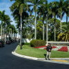 FILE - The motorcade for President Donald Trump arrives at Trump International Golf Club, Jan. 2, 2026, in West Palm Beach, Fla.