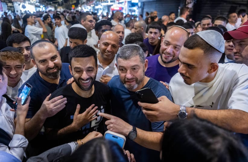 People of Israel party chairman Ofer Winter and party member Yoseph Haddad tour the Mahane Yehuda Market in Jerusalem ahead of the upcoming general elections, September 17, 2026.