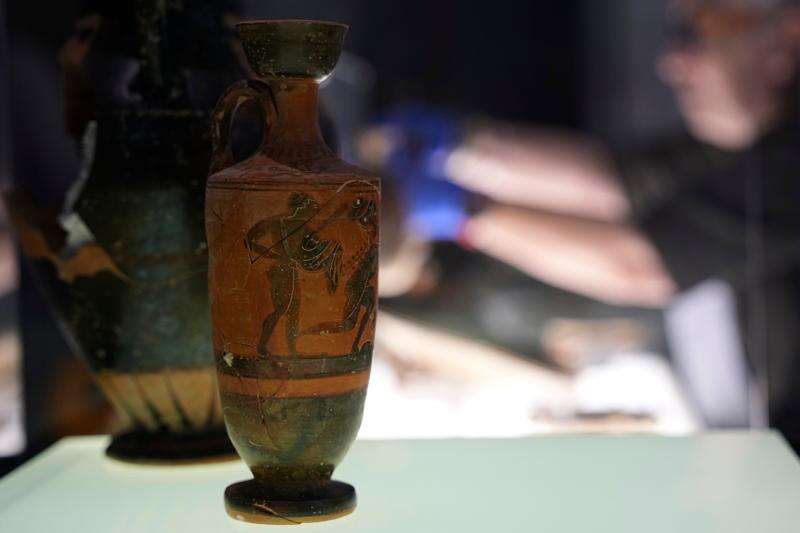 Greek antiquities dating to the 6th and 5th centuries B.C. are displayed during a repatriation ceremony at the National Archaeological Museum in Athens, Greece, Tuesday, Oct. 13, 2026, after 22 artifacts illegally removed from Greece were returned by Israel. (AP Photo/Thanassis Stavrakis)