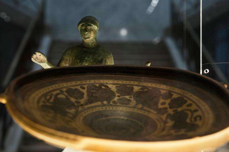 Greek antiquities dating to the 6th and 5th centuries B.C. are displayed during a repatriation ceremony at the National Archaeological Museum in Athens, Greece, Tuesday, Oct. 13, 2026, after 22 artifacts illegally removed from Greece were returned by Israel. (AP Photo/Thanassis Stavrakis)
