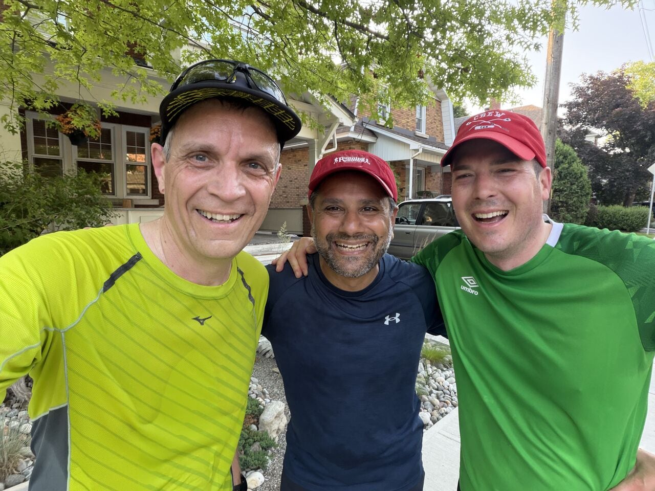 Three men in colourful running clothes