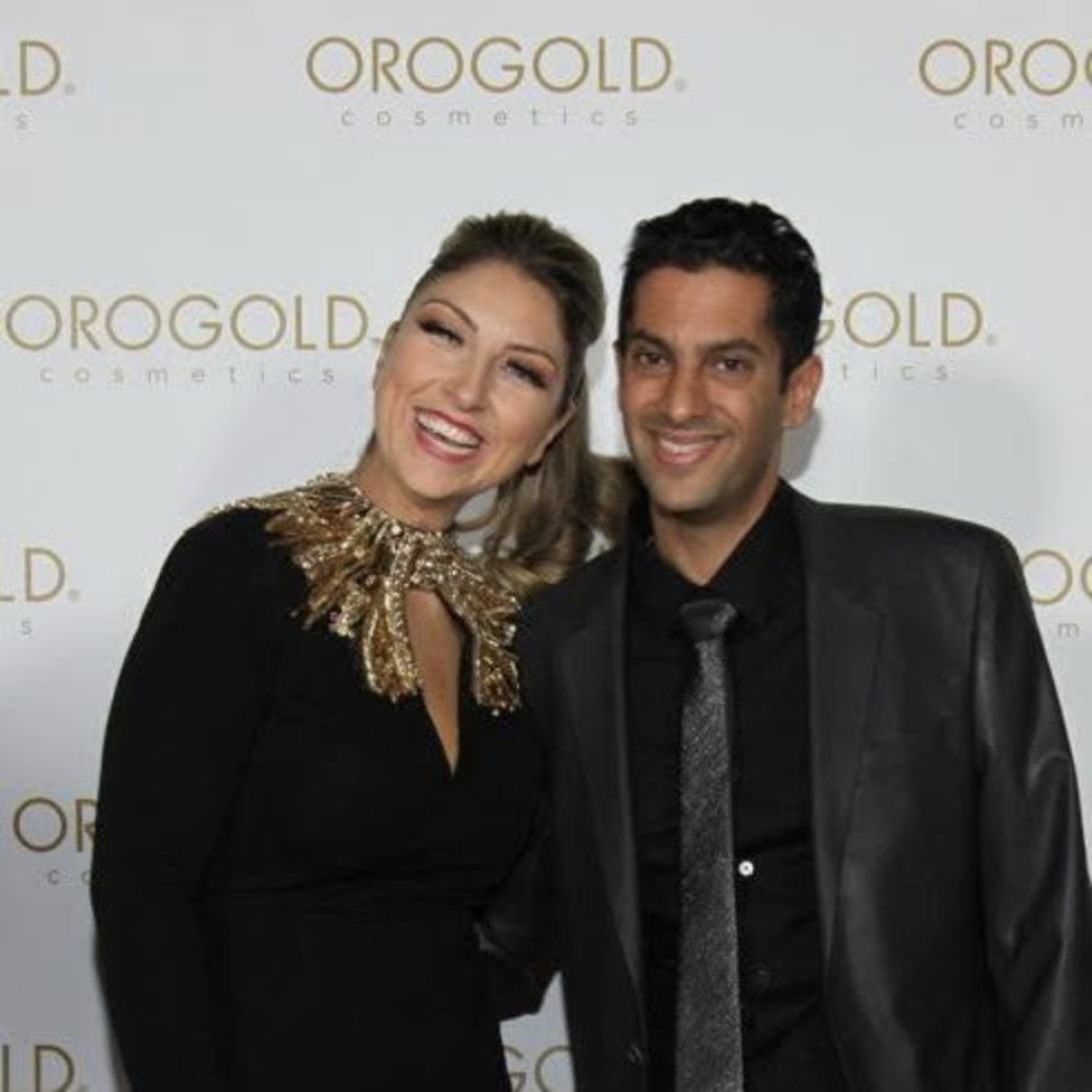 Adi Sharvit Oded and Avihu Oded pose for a picture at an Orogold Cosmetics event in 2014.
