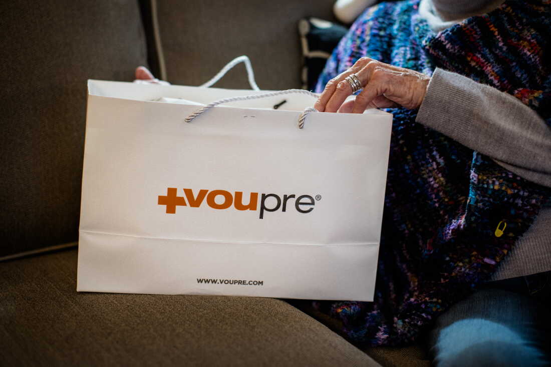 Suzann Roberts holds a paper bag of Voupre skincare products from Beauty Essentials in Ann Arbor, Michigan.