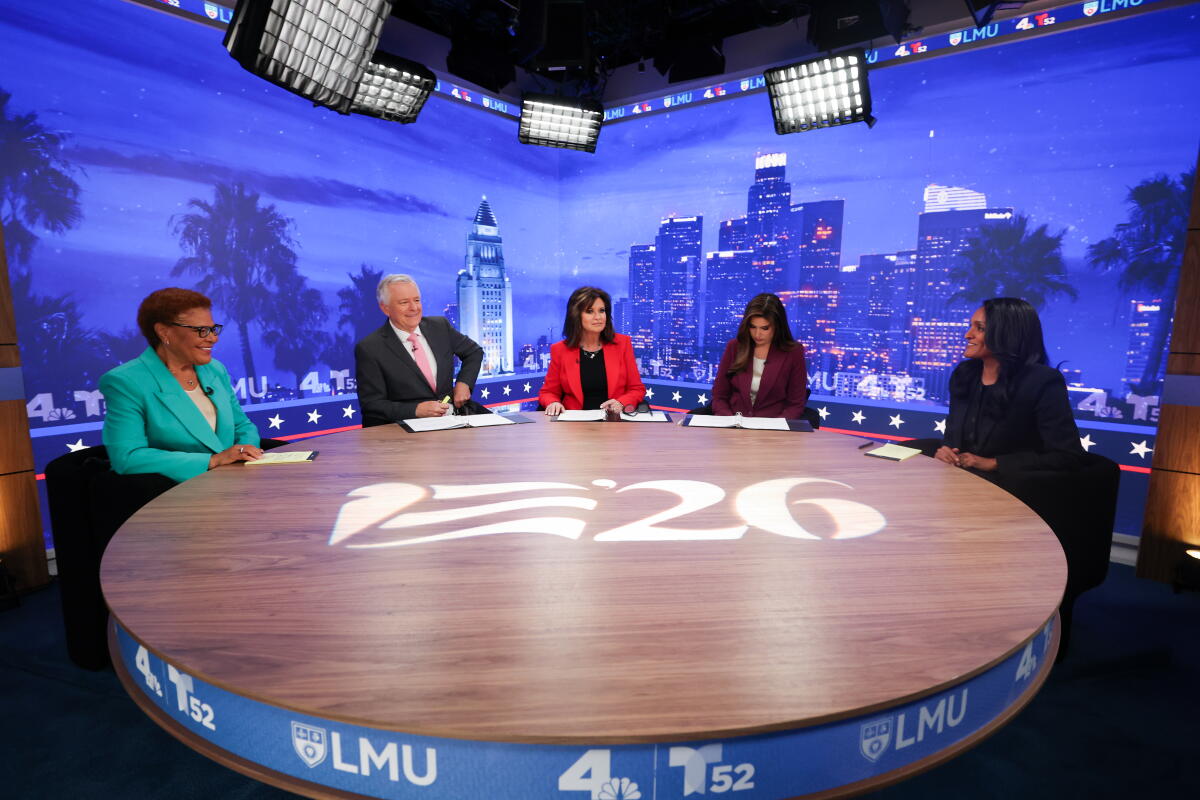 Incumbent Mayor Karen Bass (left) sits for a debate with City Councilmember Nithya Raman (right)