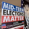 Signs reading "Midterm Elections Matter, Vote Conservative" and a photo of President Trump with the word Vote across the bottom seen on a Kansas GOP bus tour across the state to bolster Republican candidates in an unusually competitive year.