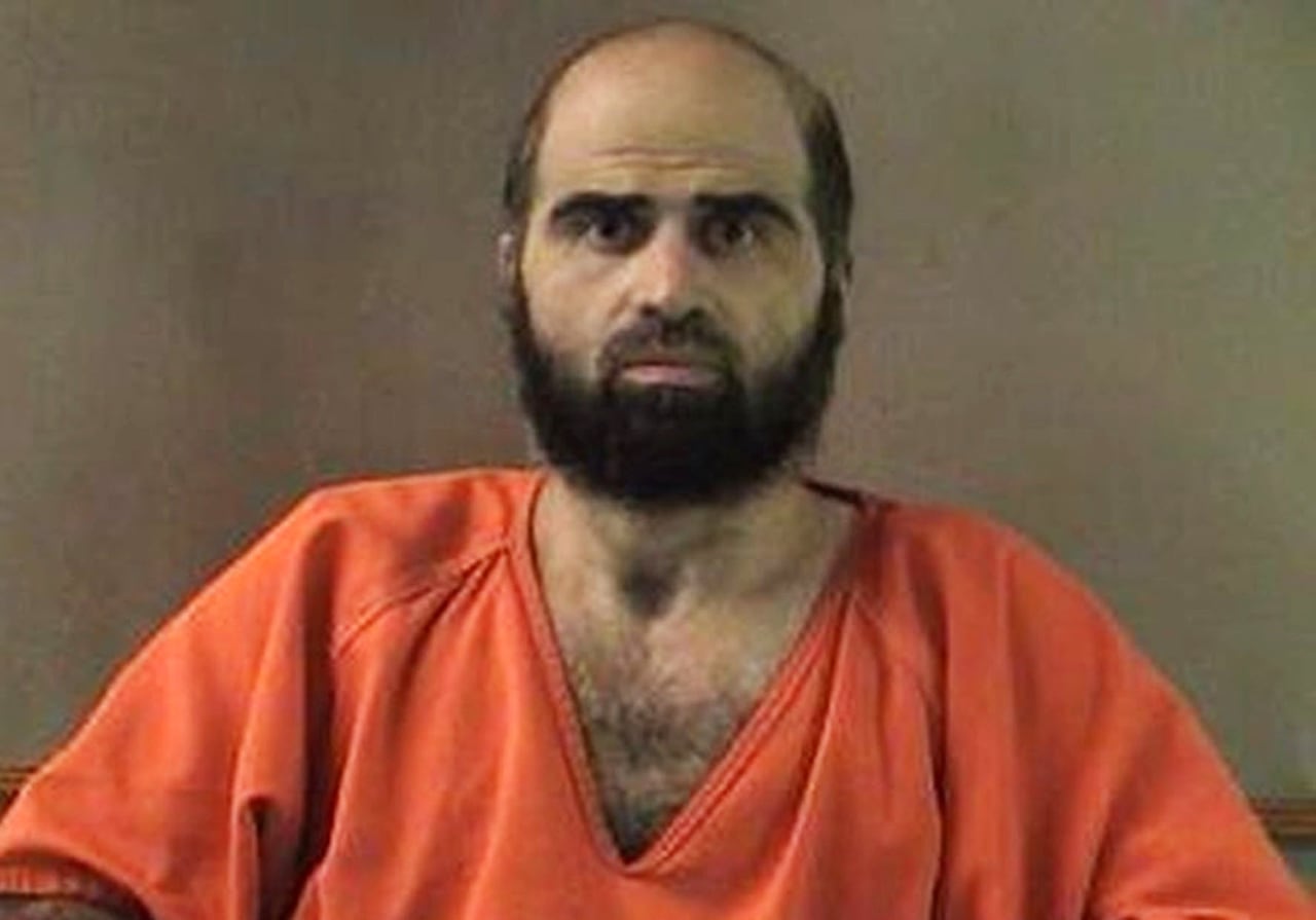 A man in an orange jumpsuit