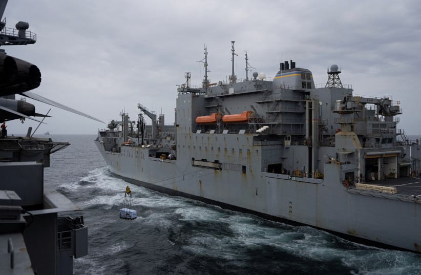 The USS George Washington conducts a replenishment at sea, receiving food and supplies from another vessel in the Arabian Sea, September 14, 2026. The aircraft carrier, capable of carrying more than 5,000 personnel, is enforcing a US naval blockade against Iran.