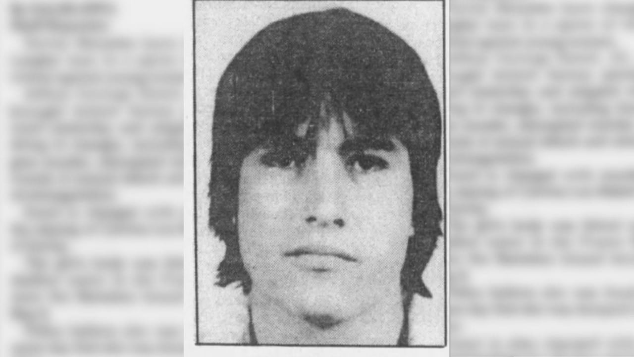 A newspaper clipping of a man's photo.