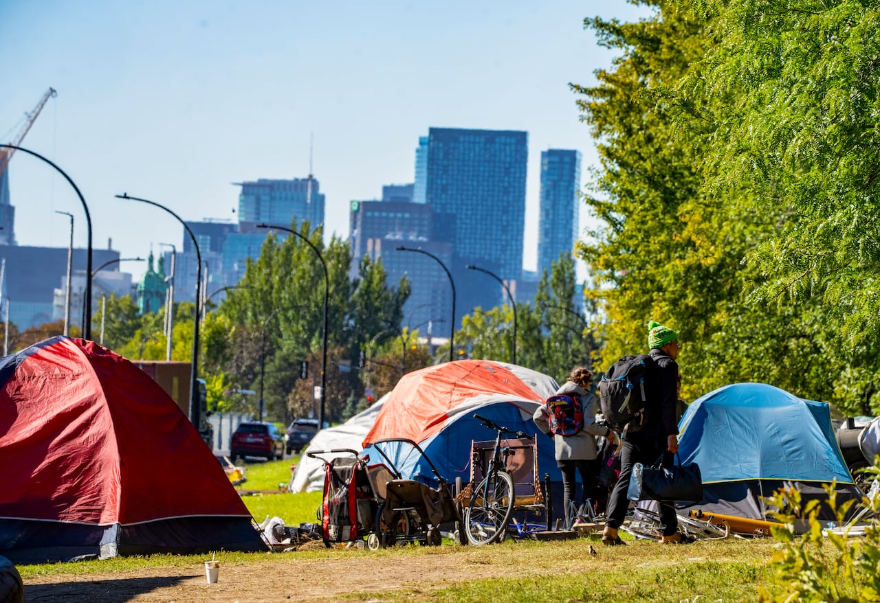 tents with the backdrop of the Montreal skyline