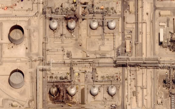 A satellite image taken July 30, 2026, shows damage to tanks at Saudi Aramco's Abqaiq oil processing facility, which was attacked on July 27, 2026. 