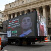 A truck displays pictures of Luigi Mangione on April 25, 2025 in New York City, as he was set to appear for the arraignment on charges that he murdered the CEO of UnitedHealthcare last year.