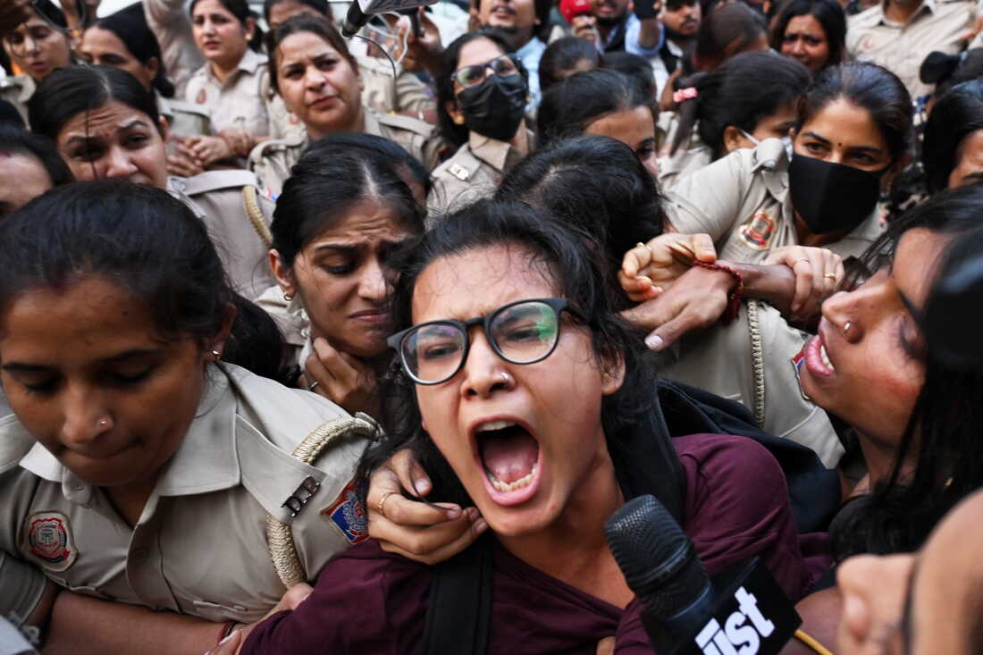 Prominent student leader Neha Bora, center, shouts slogans as she is detained by the police during a youth demonstration demanding the resignation of the country's election chief Gyanesh Kumar, in New Delhi, India, Friday, Oct. 16, 2026.
