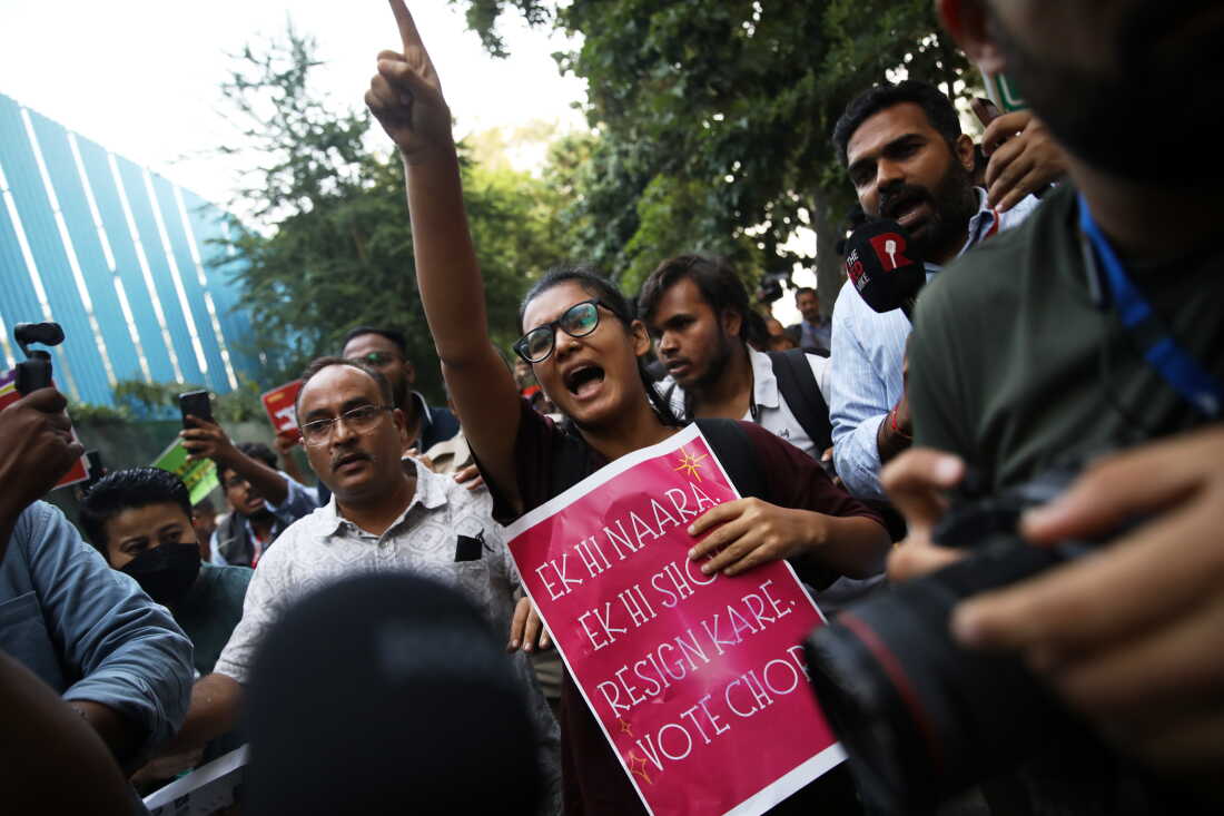 Student activist Neha Bora, center, shouts slogans during a youth demonstration demanding the resignation of the country's election chief Gyanesh Kumar, in New Delhi, India, Friday, Oct. 16, 2026.