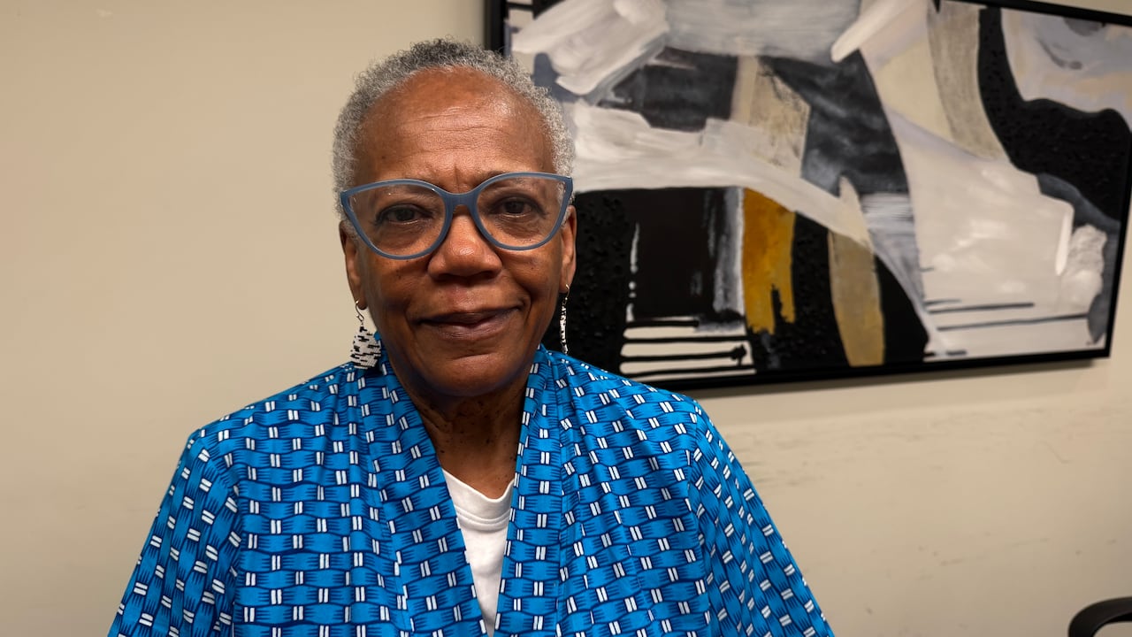Portrait of a woman in glasses.