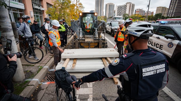 3rd person arrested as cyclists protest removal of bike lanes in Toronto
