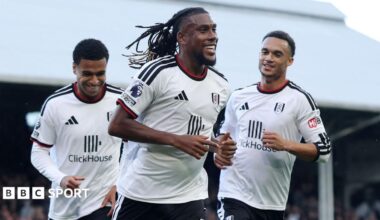 Fulham's Alex Iwobi jogs towards the stands as he celebrates scoring with his team-mates