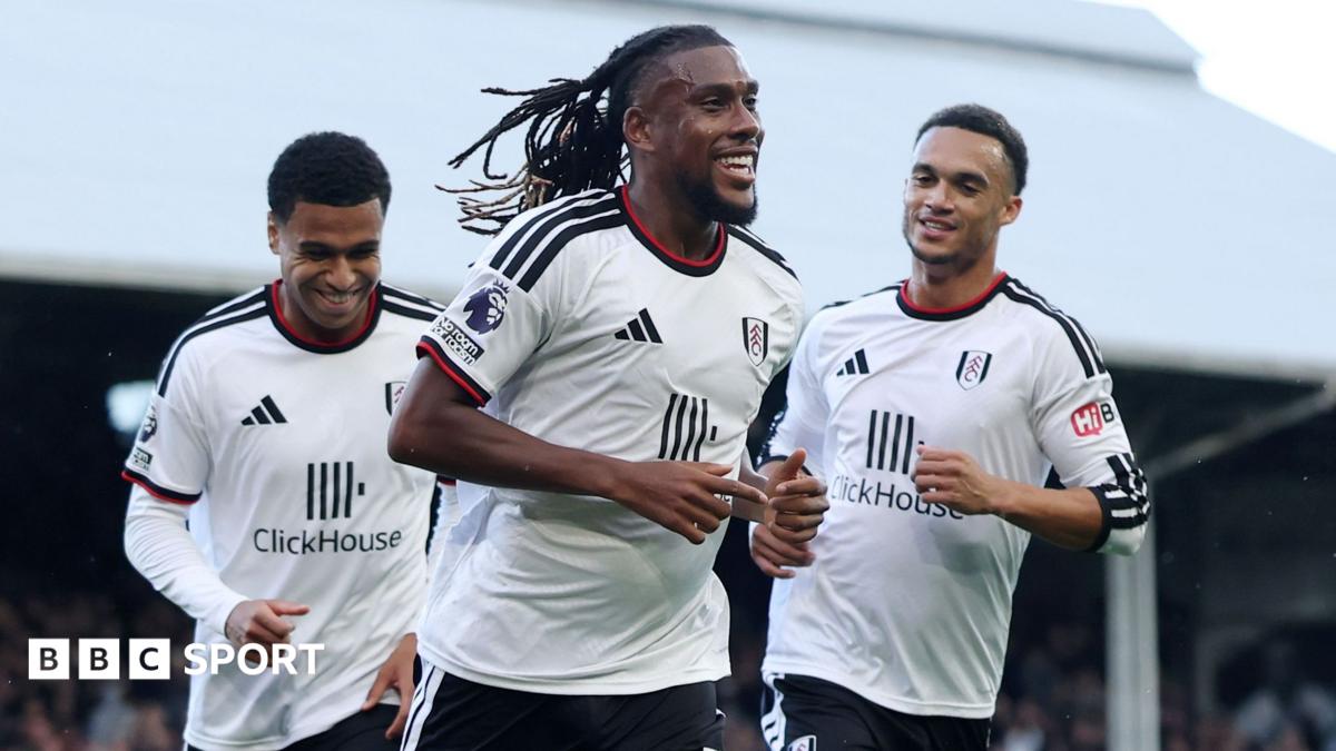Fulham's Alex Iwobi jogs towards the stands as he celebrates scoring with his team-mates