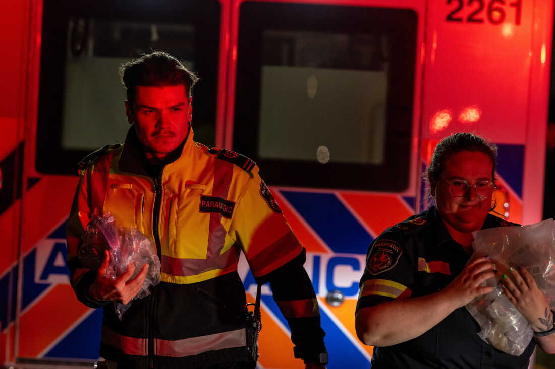 Paramedics work at the Wainwright Health Centre as injured military members are treated after a fire at Canadian Forces Base Wainwright, outside of Wainwright, Alberta Saturday, Oct. 17, 2026.